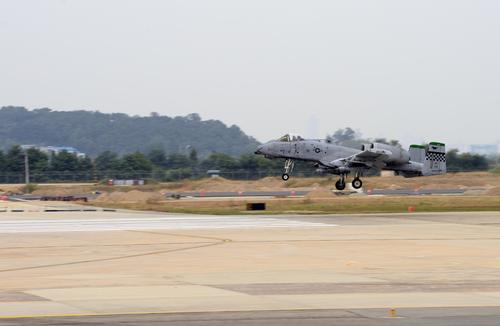 A U. S. Air Force A-10 Thunderbolt II from the 25th Fighter Squadron lands at Osan Air Base, Republic of Korea, Oct. 7, 2015, following a close air support training sortie.  The A-10 is capable of a variety of missions, to include close air support, airborne forward air control, and combat search and rescue.  (U.S. Air Force photo by Capt. Robert Howard/Released)
