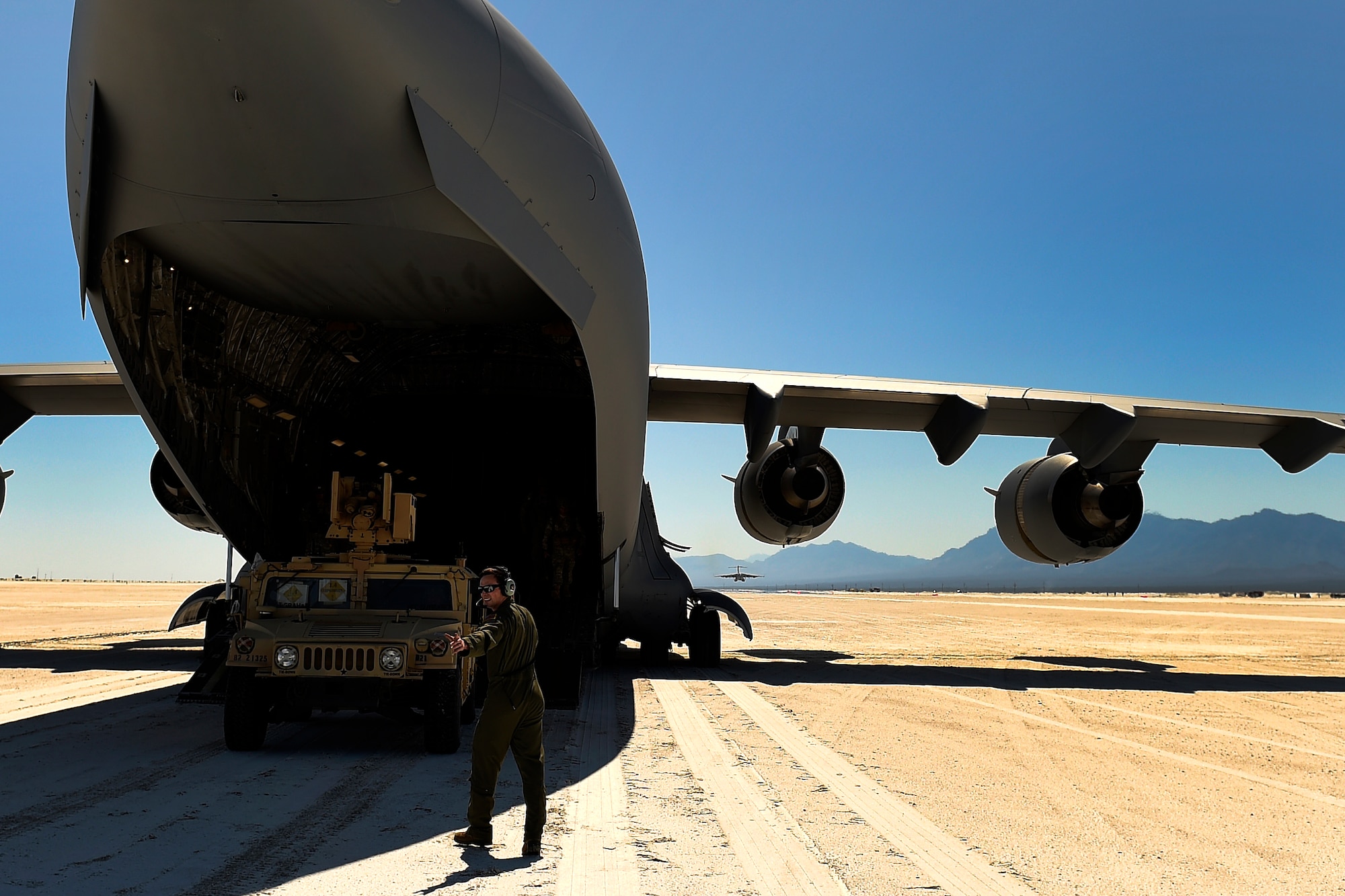Airmen from the 62nd Airlift Wing deliver Soldiers and Humvees from the 82nd Airborne Division to White Sands, N.M., Sept. 27, 2015. The delivery was made via Semi-Prepared Runway Operations. (U.S. Air Force photo/Staff Sgt. Tim Chacon)