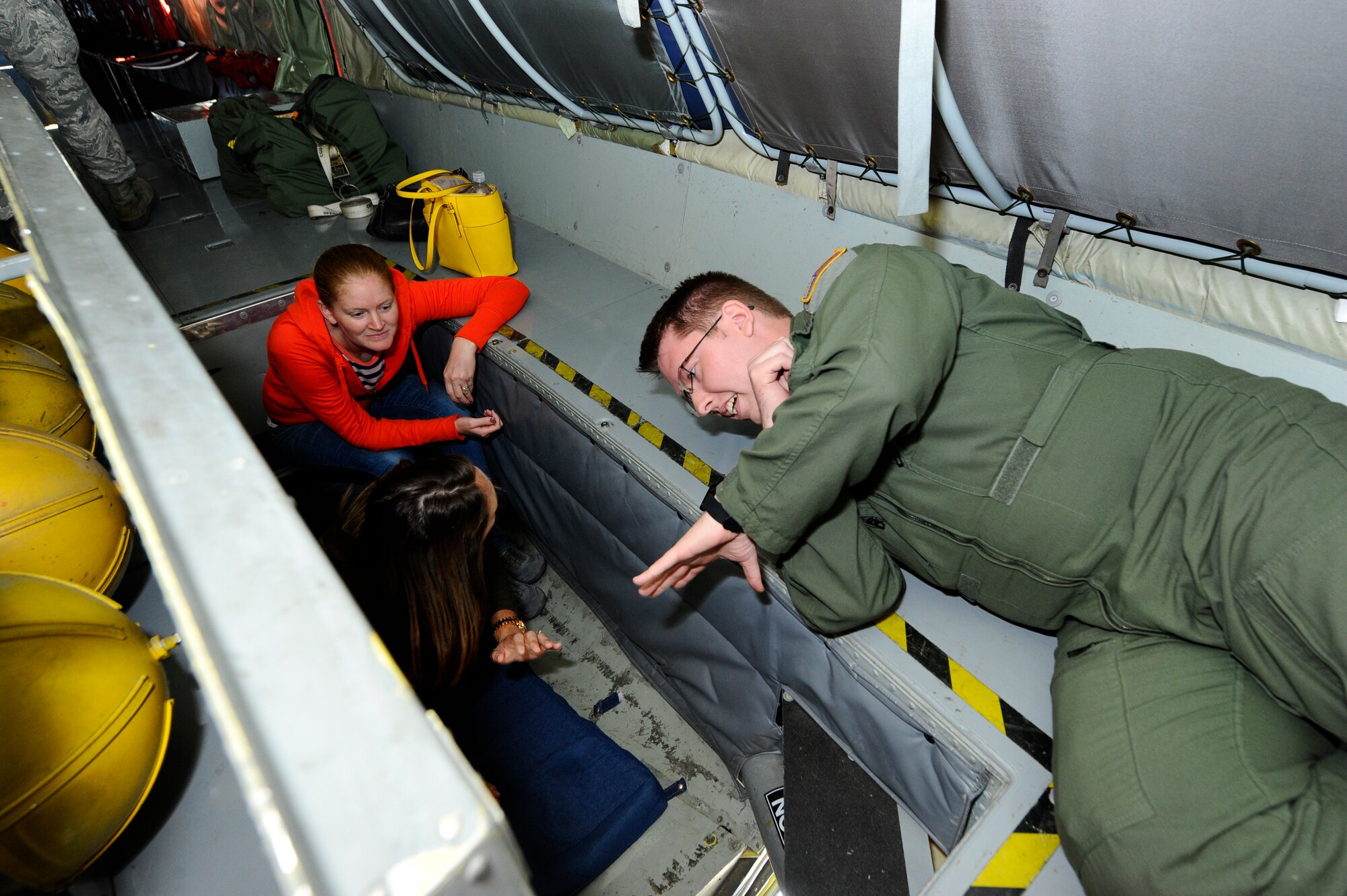 Team McConnell spouses speak with members of helping organizations from around base during a spouse appreciation day event, Oct. 2, 2015, at McConnell Air Force Base, Kan. The event allowed spouses to see what happens on a daily basis around McConnell, and provided them with information about the various organizations they can utilize. (U.S. Air Force photo by Senior Airman Victor J. Caputo)