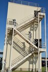 Firefighters from the 507th Civil Engineer Squadron climb the steps of the fire training tower for 56 minutes during the annual 9/11 fire climb Sept. 13, 2015 at Tinker Air Force Base, Okla. This marks the 6th year that the Reservists have commemorated the victims and workers of 9/11 attacks by climbing the fire training tower for 56 minutes, which is the time it took for the south tower to collapse after being struck by an airliner. (U.S. Air Force photo/Maj. Jon Quinlan)