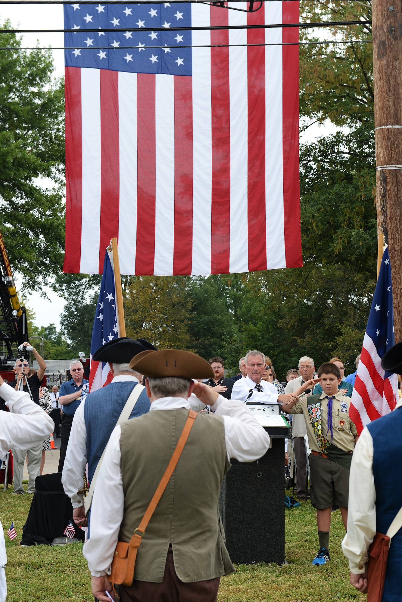 A boy scout leads the Pledge of Allegiance during a dedication of a cenotaph to Capt. Joseph Ogle at the Shiloh Valley Cemetery, Shiloh, Illinois, Sept. 27, 2015. Ogle was an Illinois territory pioneer and Revolutionary War patriot who settled in St. Clair County after the War and founded the First Methodist Church in Shiloh when Illinois was a territory. (U.S. Air Force photo by Airman 1st Class Erica Holbert-Siebert)