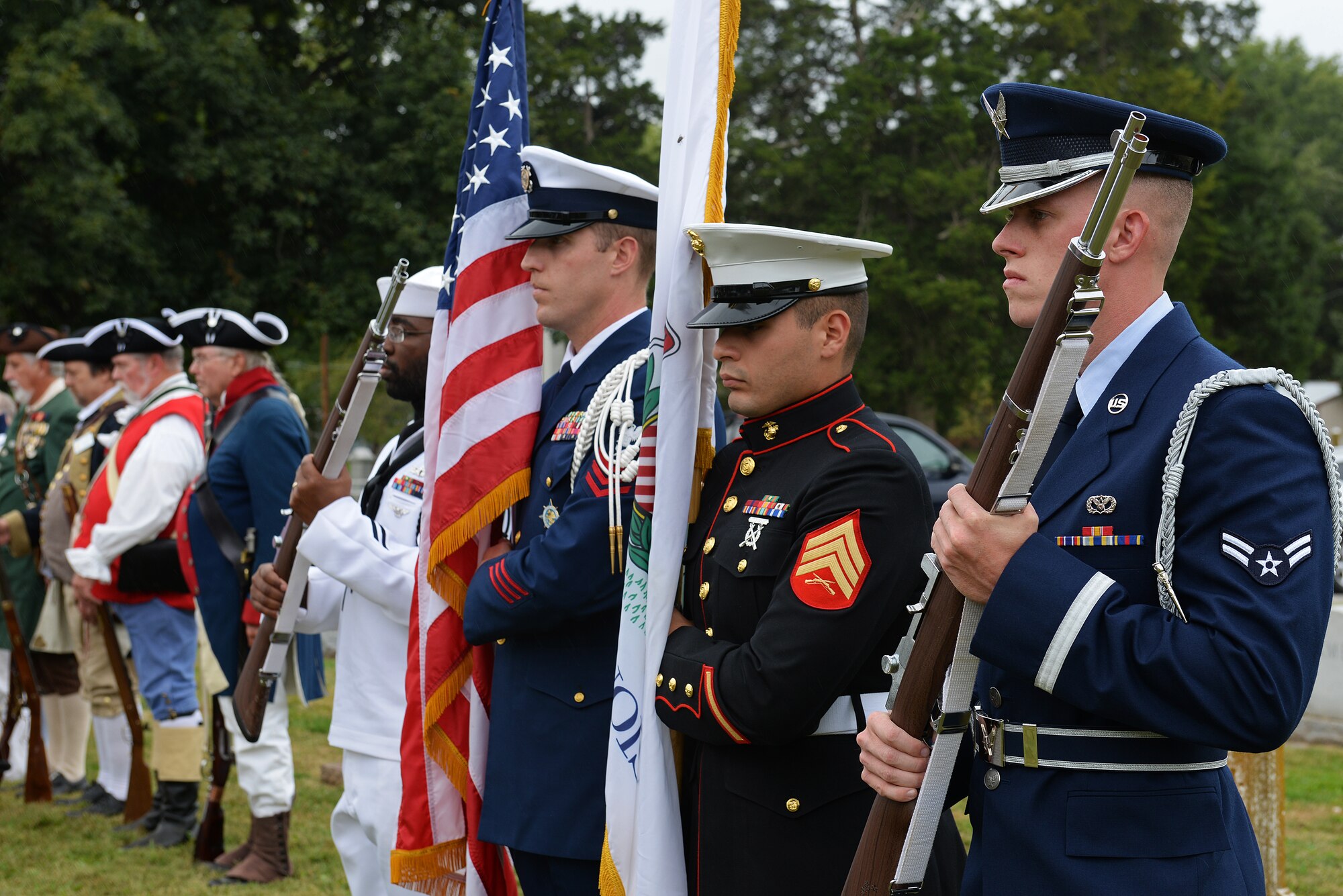 The Scott Air Force Base, Illinois Color Guard performs with the Sons of the American Revolution Color Guards during a dedication of a cenotaph to Capt. Joseph Ogle at the Shiloh Valley Cemetery, Shiloh, Illinois, Sept. 27, 2015. Ogle was an Illinois territory pioneer and Revolutionary War patriot who settled in St. Clair County after the War and founded the First Methodist Church in Shiloh when Illinois was a territory. (U.S. Air Force photo by Airman 1st Class Erica Holbert-Siebert)