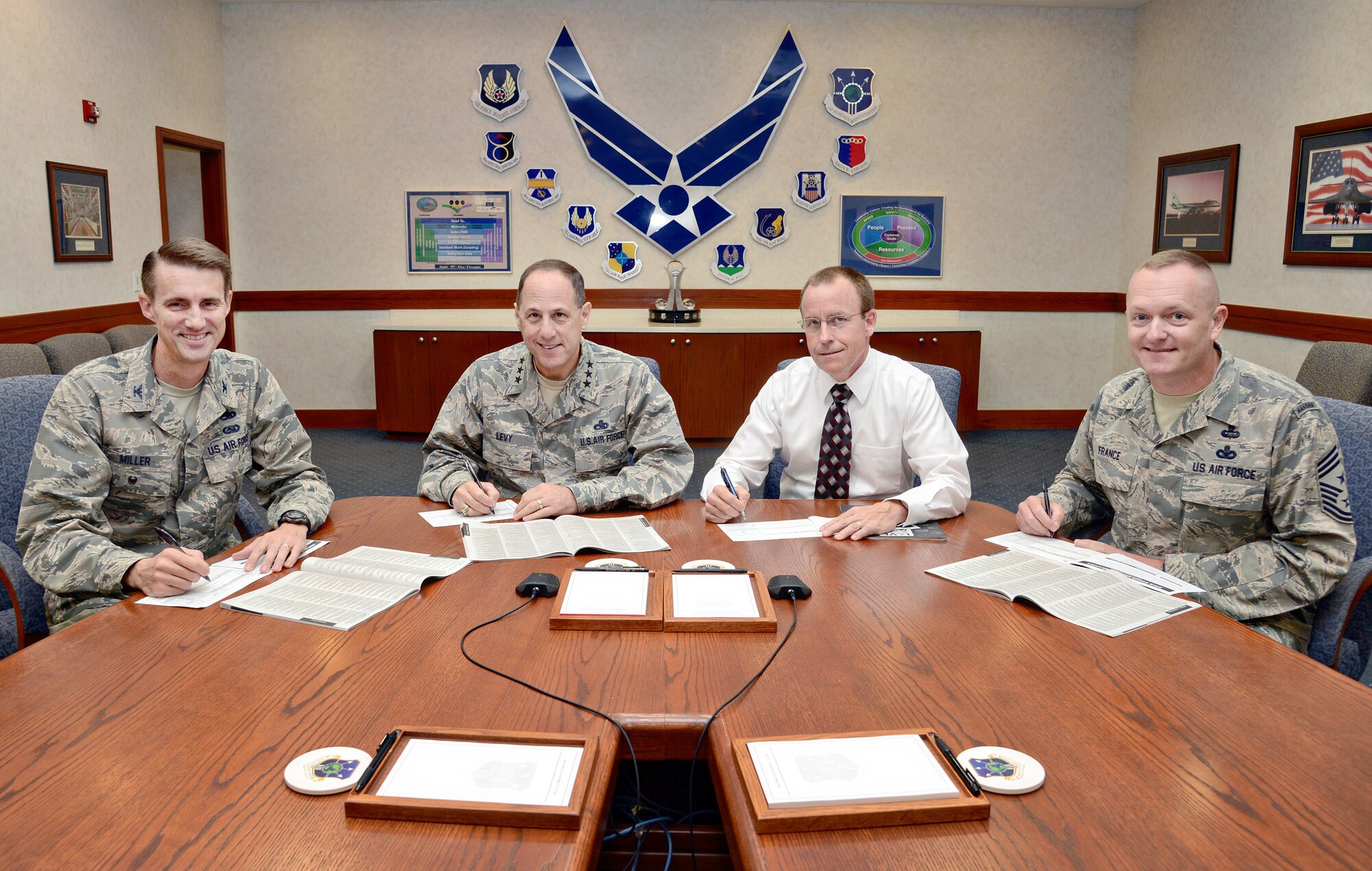 Signing their 2015 Combined Federal Campaign pledge cards Oct. 6 are, from left, Air Force Sustainment Center Vice Commander Col. Tom Miller, AFSC Commander Lt. Gen. Lee Levy II, AFSC Executive Director Jeffrey Allen and AFSC Command Chief Master Sgt. Jason France. Tinker’s 2015 CFC runs through Nov. 22. A fair with information on participating charities will be held from 10 a.m. to 1 p.m. Oct. 14 in the Oklahoma Room, Bldg. 3001. For more information on this year’s campaign, email 2015tinkercfc@gmail.com. 