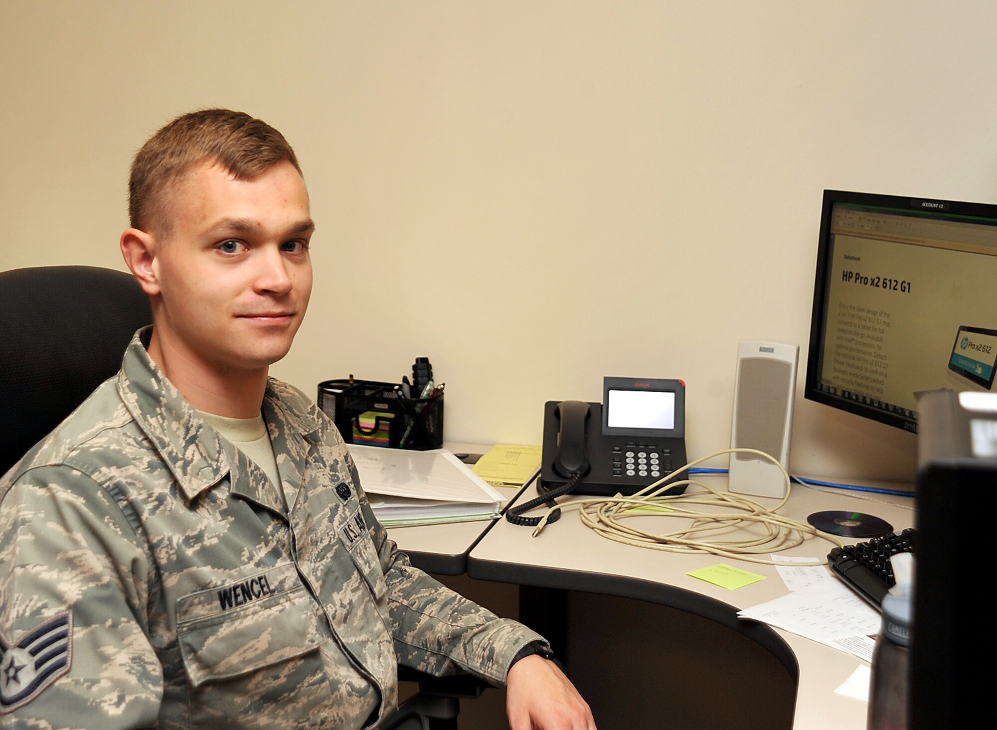 Staff Sgt. Steven Wencel, 319th Communications Squadron client systems supervisor, pauses from his duties for a photo on Grand Forks Air Force Base, North Dakota, Oct. 8, 2015. Wencel was selected Warrior of the Week for the second week of October 2015. (U.S. Air Force Photo by Airman 1st Class Bonnie Grantham/released)