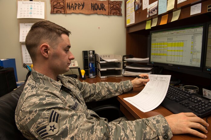Senior Airman James Hauck, 628th Comptroller Squadron budget analyst, cross references accounts on the Defense Enterprise Accounting and Management System in the finance office on Joint Base Charleston – Air Base, S.C., Oct. 7, 2015. This is the first year that D.E.A.M.S. was fully integrated into the office.