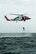 A rescue swimmer, from Coast Guard Air Station Elizabeth City, North Carolina, lifts Capt. Alex Arbuckle, 334th Fighter Squadron pilot, out of the water into a HH-60J Jayhawk during a search and rescue training mission, Sept. 24, 2015, off the coast of North Carolina. Airmen from Seymour Johnson Air Force Base, North Carolina and sailors from Coast Guard Air Station Elizabeth City and Coast Guard Station Hobucken, North Carolina worked together to locate and rescue a simulated ejected pilot and weapons systems officer as part of a joint training exercise. (U.S. Air Force photo/Airman Shawna L. Keyes)  