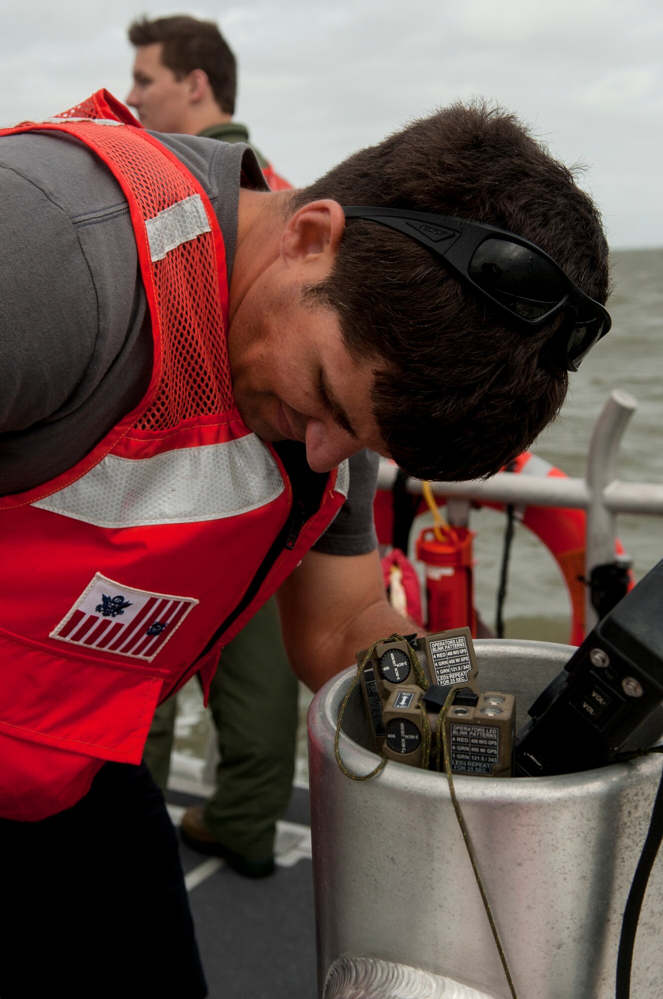 Tech. Sgt. Scott Millisor, 4th Operation Support Squadron NCO in charge of weapons and tactics, monitors a radio during a search and rescue training exercise, Sept. 24, 2015, off the coast of North Carolina. During the scenario, Millisor stayed in constant contact with Airmen in the water, making sure they followed water survival training techniques. (U.S. Air Force photo/Airman Shawna L. Keyes)