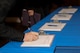 Members of Team Seymour sign in before entering a job fair, Oct. 6, 2015, at Seymour Johnson Air Force Base, North Carolina. The job fair was organized by the Airman and Family Readiness Center to assist military members, spouses and retirees find careers. (U.S. Air Force photo/Airman 1st Class Ashley Williamson)