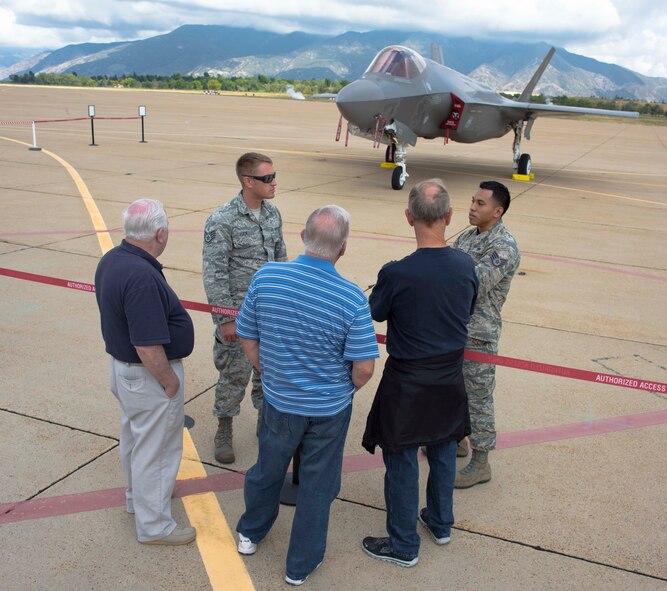 Staff Sgt. Aaron Ramirez and Staff Sgt. Jordan Tuck, 419th Maintenance Group, teach retired reservists about the new F-35 Lightning II at the unit’s 60th anniversary celebration at Hill Air Force Base Oct. 3. The 419th Fighter Wing is the first Air Force Reserve unit to fly combat-coded F-35s, which arrived here last month. The Airmen showcasing the jet at the weekend celebration have already received training on the new airframe. Aside from interactive aircraft displays, events for the 60th anniversary included a gala banquet, sporting events, and family activities throughout the weekend. (U.S. Air Force photo/Tech. Sgt. Michael McCool) 