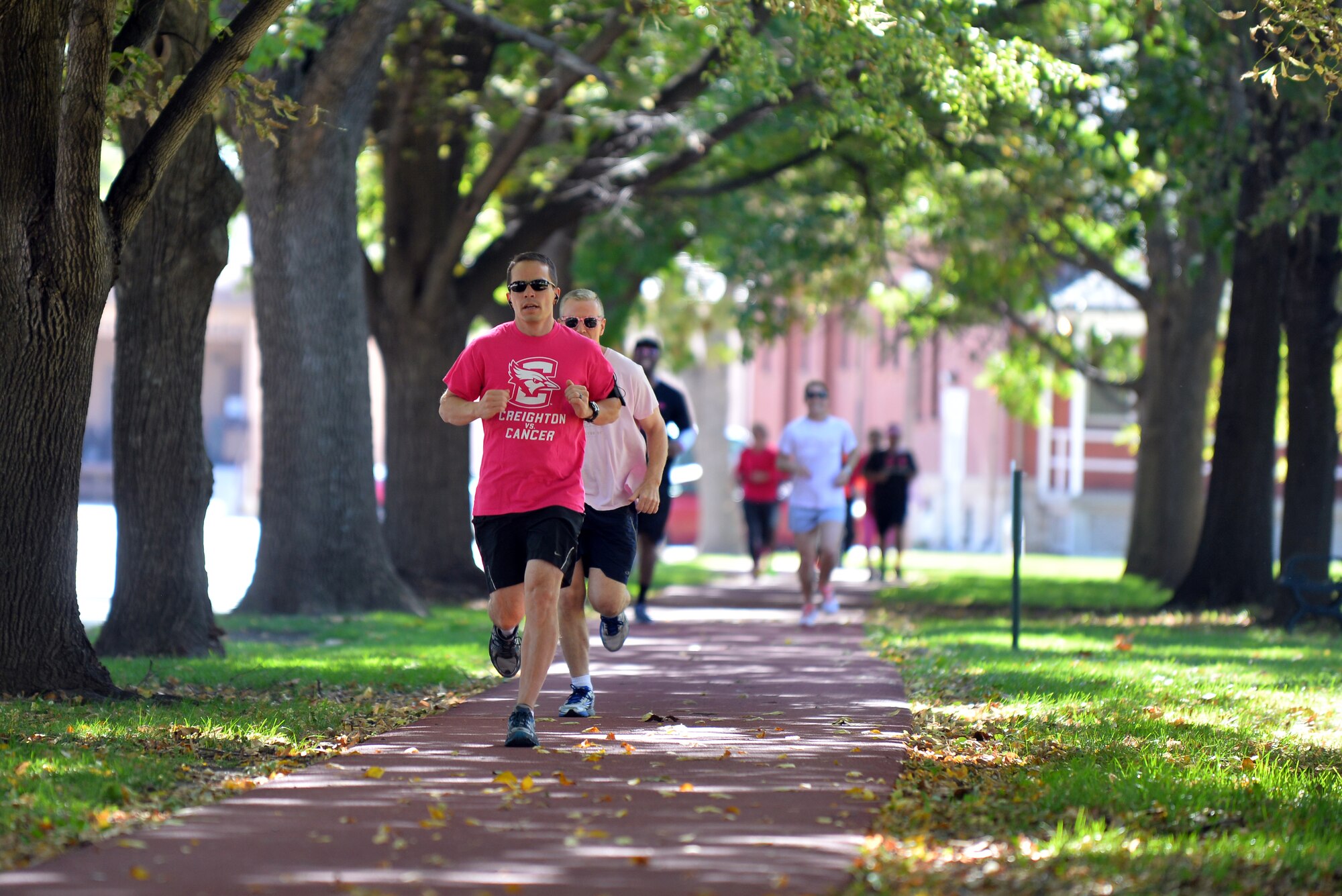 Maj. Brian Palmer, United States Strategic Command, runs in a 5K to help bring awareness to breast cancer Oct. 2 on the Offutt Air Force Base, Neb., parade grounds.  Numerous runners from across the base came to participate and show support for the cause.  (U.S. Air Force photo by Josh Plueger/Released)