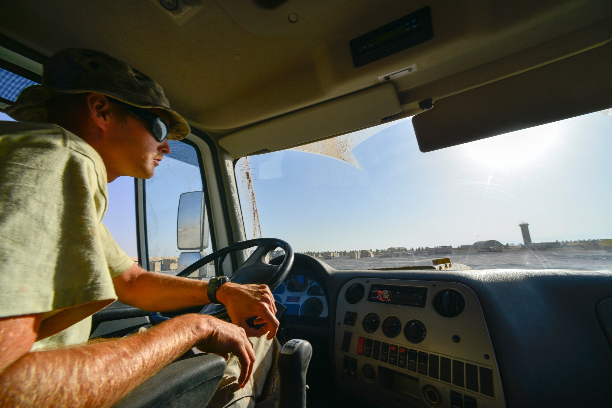 Staff Sgt. Joseph Roach, 786th Civil Engineer Squadron pavements and construction equipment operator, drives a dump truck Sept. 24, 2015, at Diyarbakir Air Base, Turkey. Roach can deliver up to three yards of gravel at a time, moving dirt to more than 14 acres of land. (U.S. Air Force photo by Airman 1st Class Cory W. Bush/Released)