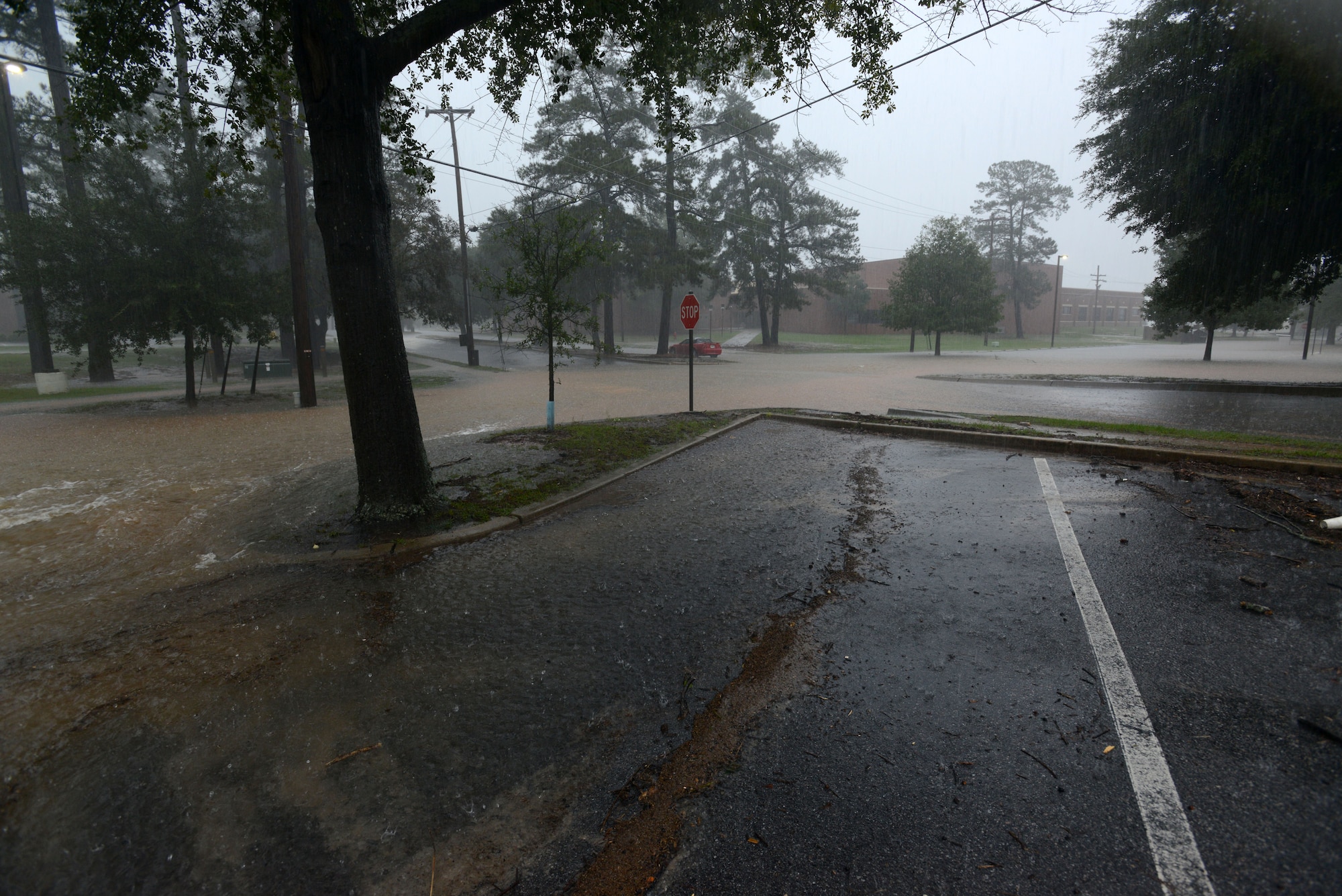 Flood waters completely submerge the area between the 20th Force Support Squadron Main Fitness Center and McElveen Information and Learning Center at Shaw Air Force Base, S.C., Oct. 4, 2015. South Carolina received record breaking rainfall, which brought more than 19 inches of rain and severe flooding to much of Shaw. 