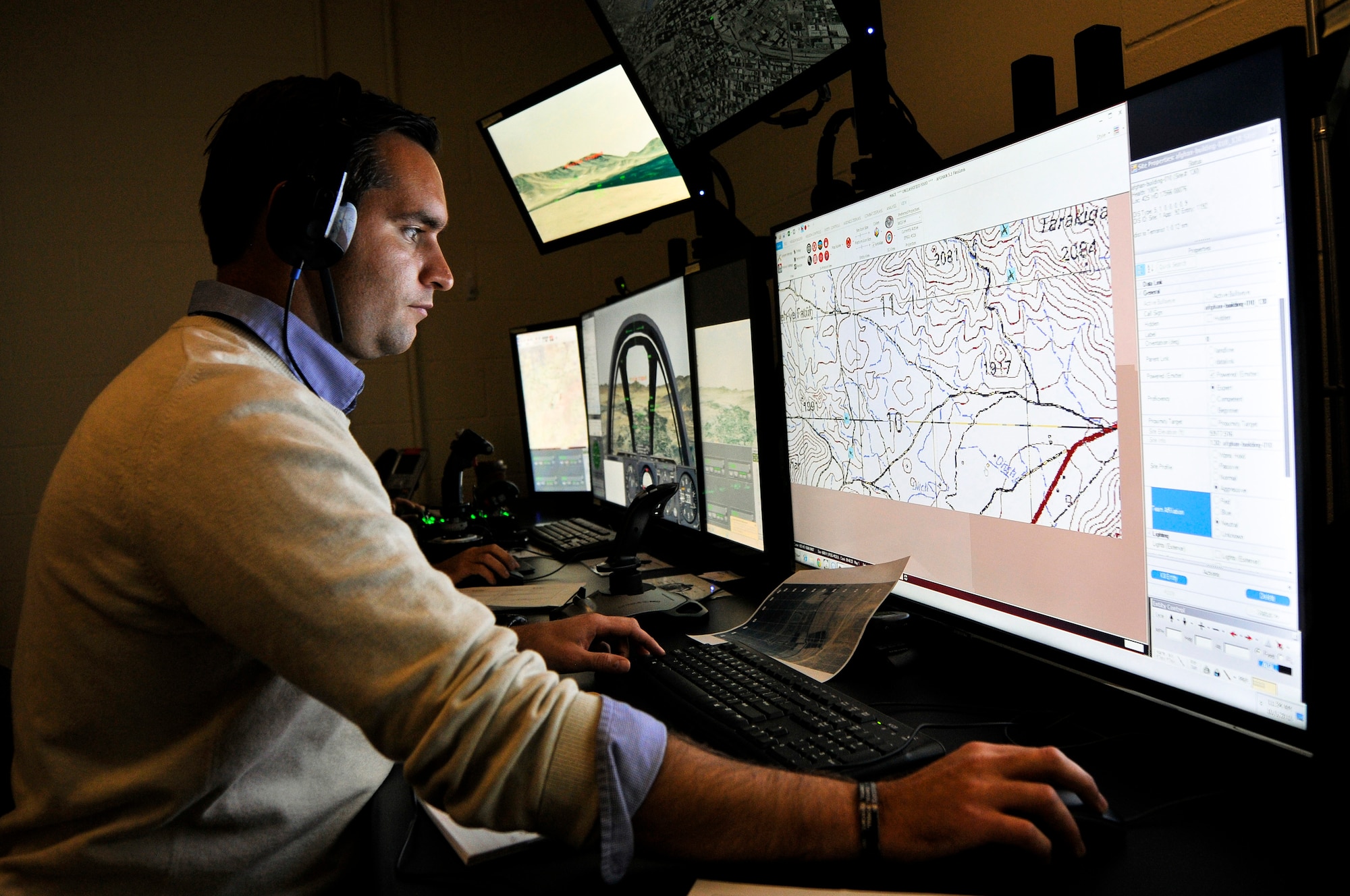 Nathan A. Hruska, simulator operator and maintainer for the 169th Air Support Operations Squadron, Illinois Air National Guard, programs a scenario in the Air National Guard Advanced Joint Terminal Attack Controller Training System during a training session at the 182nd Airlift Wing in Peoria, Ill., Oct. 5, 2015. Peoria’s TACPs teamed up with the QuantaDyn Corporation to help create the AAJTS, which is expected to potentially save the government $95 million through fiscal year 2018 by reducing the cost of qualification and continuation training by 48 percent. (U.S. Air National Guard photo by Staff Sgt. Lealan Buehrer/Released)