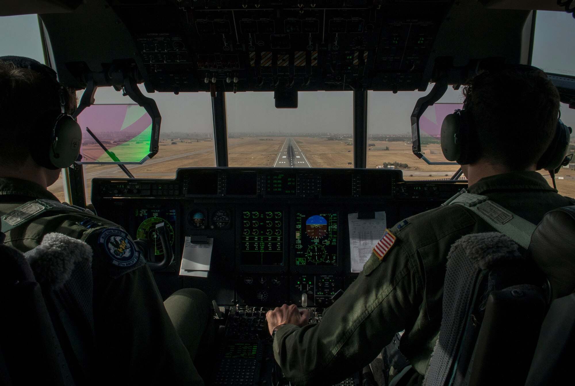 Two U.S. Air Force pilots prepare to land a C-130J Super Hercules Sept. 9, 2015, at Diyarbakir Air Base, Turkey. The aircrew delivered essential cargo to the 435th Contingency Response Group deployed to DAB in support of the build up of U.S. Air Forces Central Command’s personnel recovery deployment site and facilities at the Turkish installation. (U.S. Air Force photo by Airman 1st Class Cory W. Bush/Released)