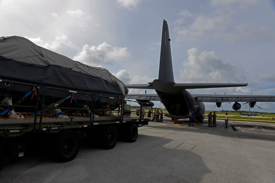 A U.S. Air Force MC-130J and MC-130H crew drop a watercraft and supplies during an exercise Sept. 19, 2015, over the Pacific Ocean. This was the first time an MC-130J Commando II completed the Maritime Craft Aerial Delivery System airdrop in the Pacific. (U.S. Air Force photo by Staff Sgt. Alexander Riedel/Released)
