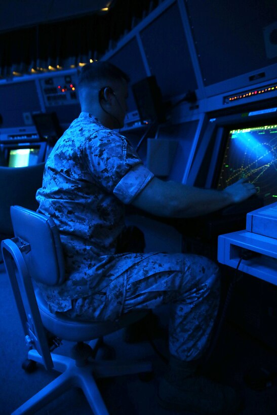 Cpl. Cody Gravley uses a surveillance scope Aug. 31 on Marine Corps Air Station Futenma. Approach and arrival controllers use the scope to assist aircraft in making their final approach. Safety measures like this contribute to the overall safety of Headquarters and Headquarters Squadron, MCAS Futenma, Marine Corps Installations Pacific-Marine Corps Base Camp Butler, Japan which reached 100,000 flight hours Oct. 1. Gravley is an air traffic controller with Marine Air Control Squadron 4, Marine Air Control Group 18, 1st Marine Air Wing, III Marine Expeditionary Force.