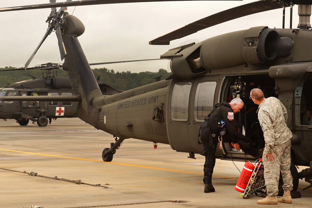 Soldiers from the South Carolina National Guard’s Army Aviation Support Facility at McEntire Joint National Guard Base, S.C., Oct. 5, 2015, prepare to conduct rescue and support operations, during a statewide flood response, Oct. 5, 2015. South Carolina Air National Guard photo by Senior Master Sgt. Edward Snyder