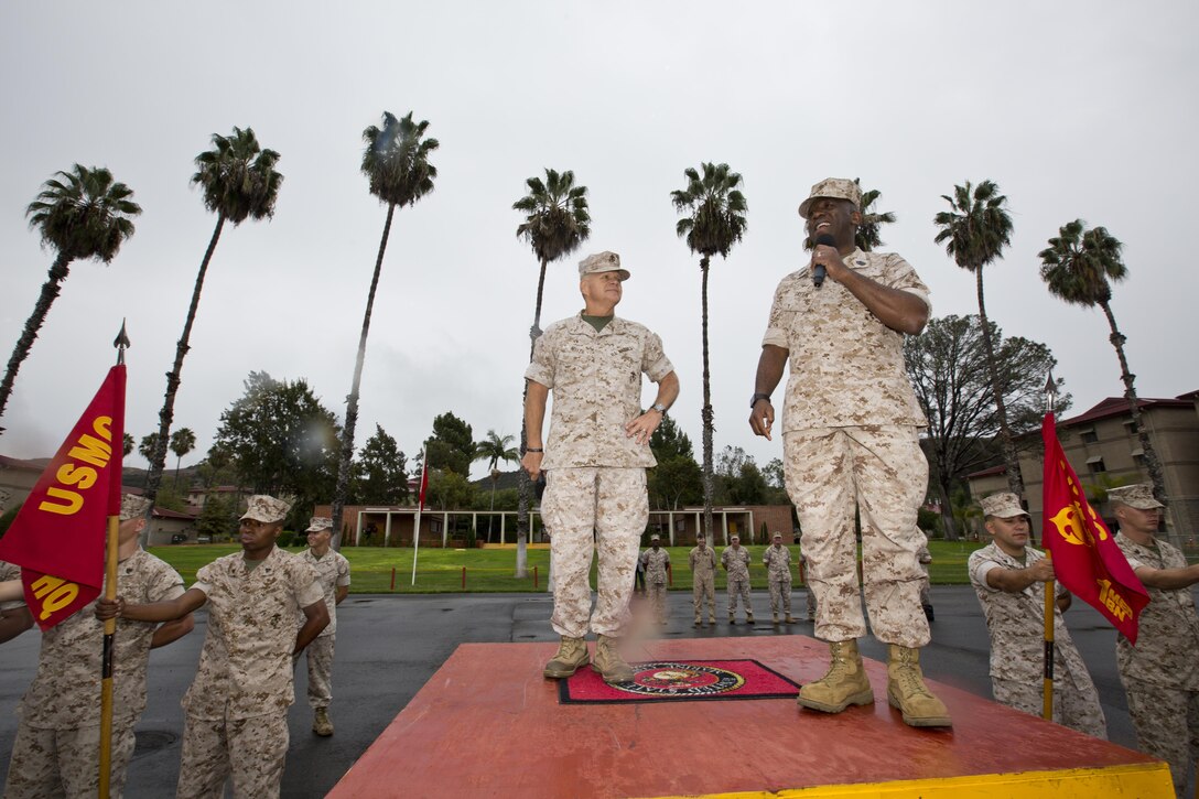 Commandant of the Marine Corps, Gen. Robert B. Neller, center, and Sgt. Maj. of the Marine Corps Ronald L. Green speak to Marines, Sailors and civilians at the 22 Area Parade Deck, Camp Pendleton, Calif., Oct. 5, 2015. Neller and Green outlined the Corps current priorities, expectations, listened and answered Marines' questions. (U.S. Marine Corps photo by Sgt. Gabriela Garcia/Released)