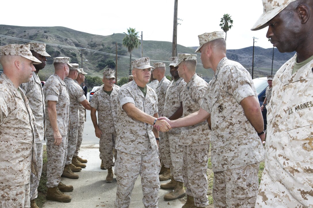 Commandant of the Marine Corps, Gen. Robert B. Neller, greets Marines at the Las Pulgas Parade Deck, Camp Pendleton, Calif., Oct. 5, 2015. Neller outlined the Corps current priorities, expectations, listened and answered Marines' questions. (U.S. Marine Corps photo by Sgt. Gabriela Garcia/Released)