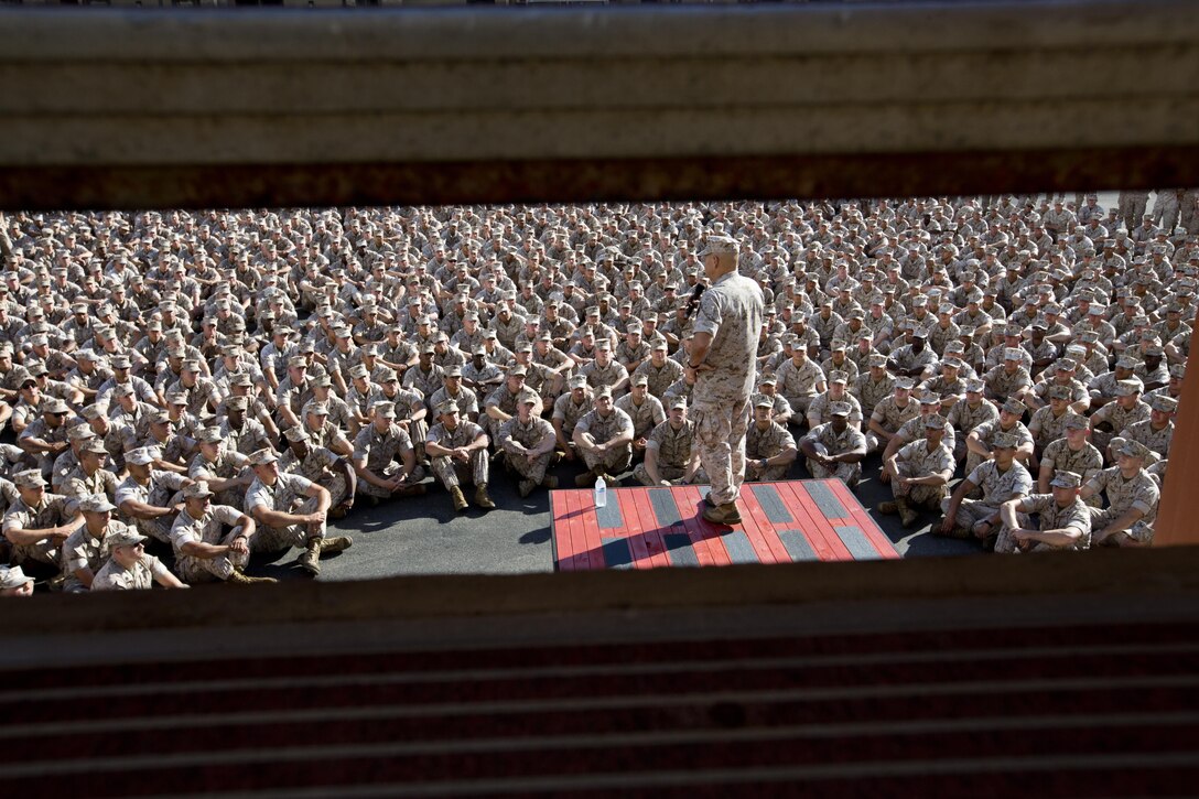 Commandant of the Marine Corps, Gen. Robert B. Neller, speaks to Marines, Sailors and civilians at the Las Flores Parade Deck, Camp Pendleton, Calif., Oct. 5, 2015. Neller outlined the Corps current priorities, expectations, listened and answered Marines' questions. (U.S. Marine Corps photo by Sgt. Gabriela Garcia/Released)
