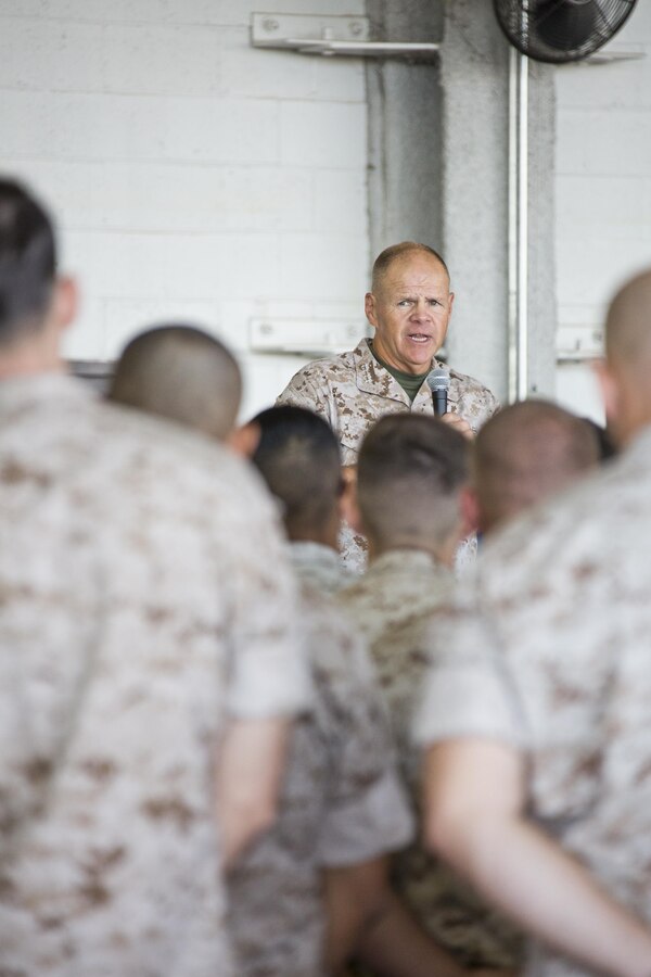 Commandant of the Marine Corps, Gen. Robert B. Neller, speaks to Marines, Sailors and civilians at Marine Corps Air Station Yuma, Ariz., Oct. 7, 2015. Neller outlined the Corps current priorities, expectations, listened and answered Marines' questions. (U.S. Marine Corps photo by Sgt. Gabriela Garcia/Released)