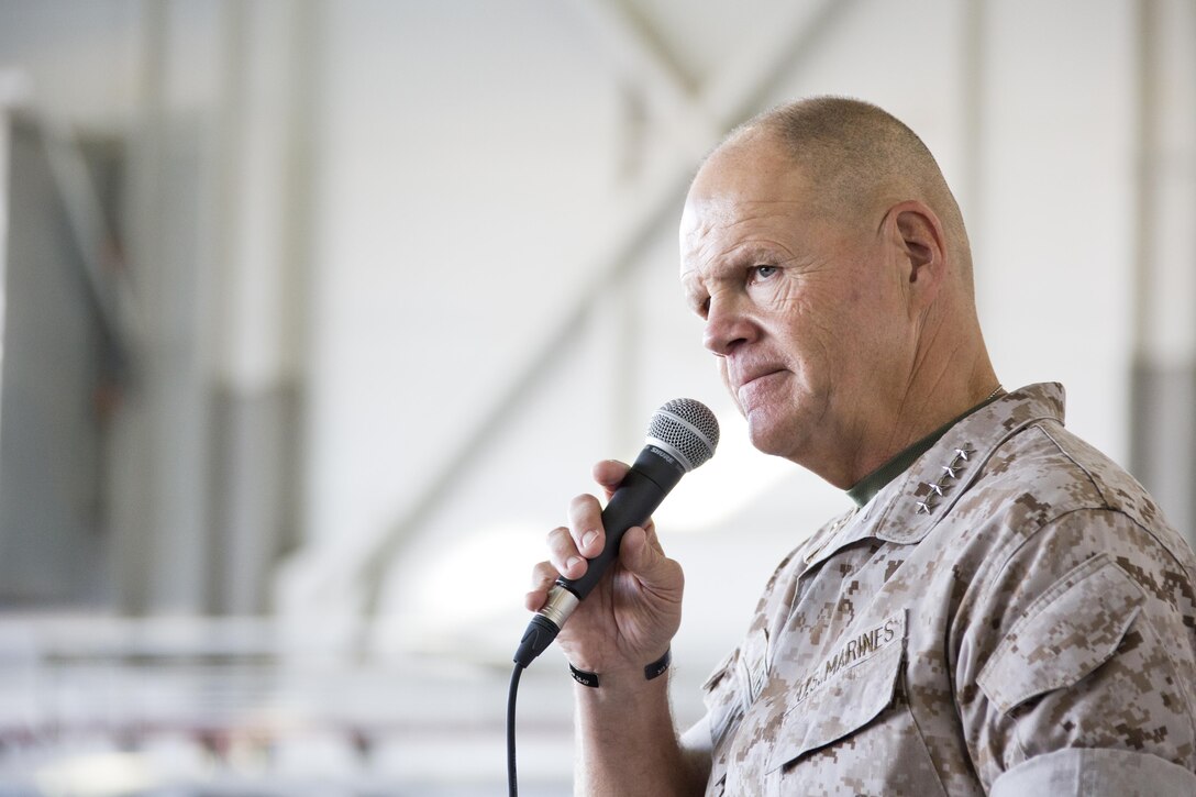 Commandant of the Marine Corps, Gen. Robert B. Neller, visits Marines, Sailors and civilians at Marine Corps Air Station Yuma, Ariz., Oct. 7, 2015. Neller outlined the Corps current priorities, expectations, listened and answered Marines' questions. (U.S. Marine Corps photo by Sgt. Gabriela Garcia/Released)