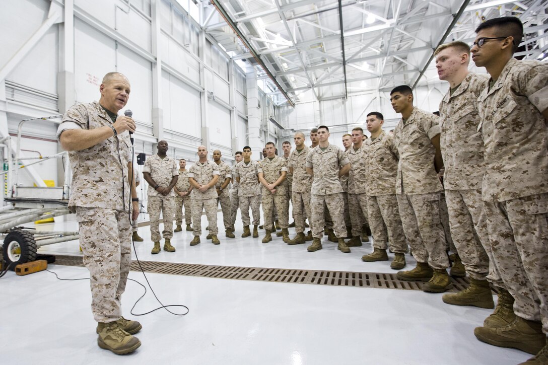 Commandant of the Marine Corps, Gen. Robert B. Neller, speaks to Marines, Sailors and civilians at Marine Corps Air Station Yuma, Ariz., Oct. 7, 2015. Neller outlined the Corps current priorities, expectations, listened and answered Marines' questions. (U.S. Marine Corps photo by Sgt. Gabriela Garcia/Released)