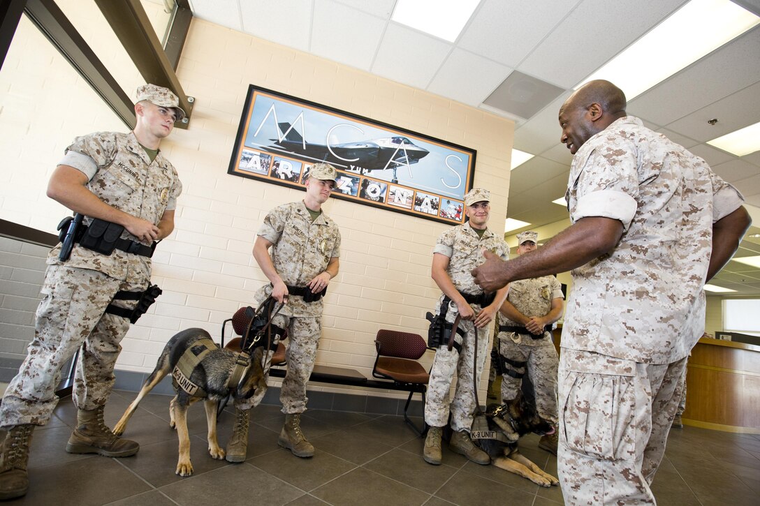 Sgt. Maj. of the Marine Corps Ronald L. Green, left, shakes hands with a Marine at Marine Corps Air Station, Ariz., Oct. 7, 2015. Commandant of the Marine Corps, Gen. Robert B. Neller, and Green outlined the Corps current priorities, expectations, listened and answered Marines' questions during their Yuma visit. (U.S. Marine Corps photo by Sgt. Gabriela Garcia/Released)