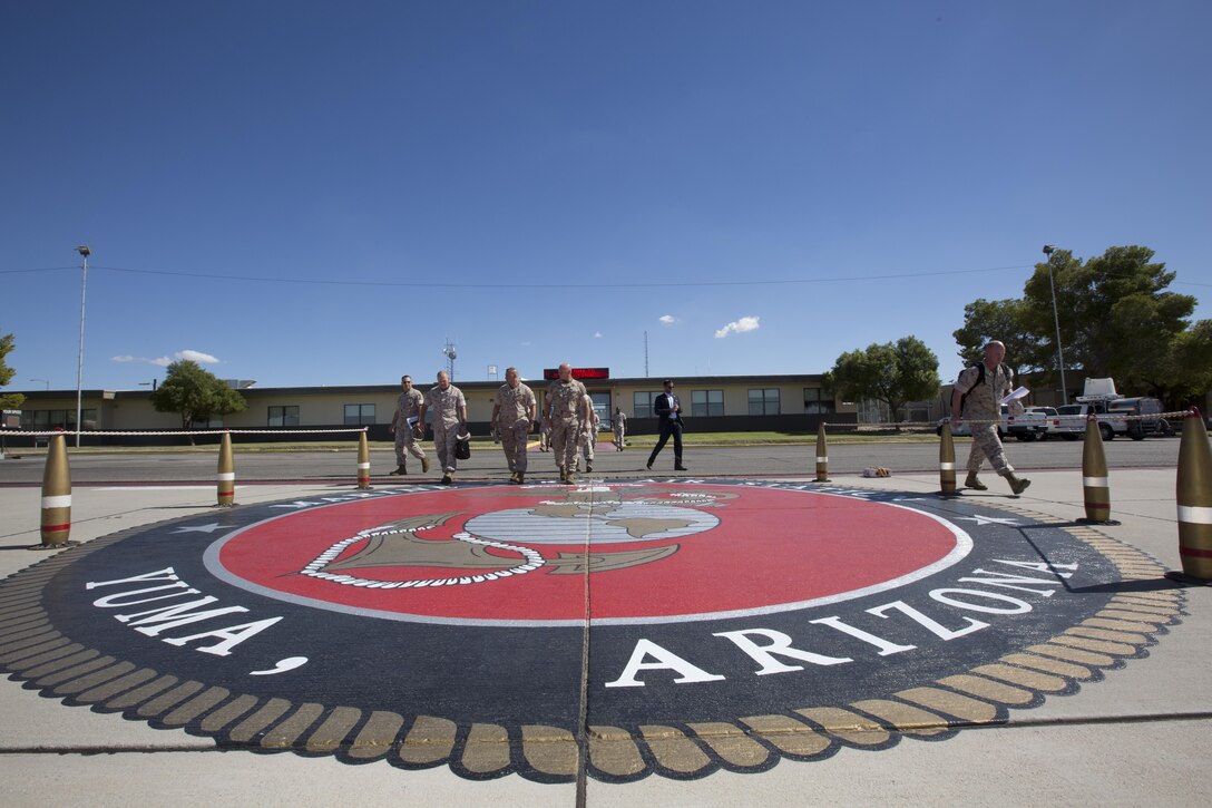 Commandant of the Marine Corps, Gen. Robert B. Neller, talks with Marines at Marine Corps Air Station Yuma, Ariz., Oct. 7, 2015. Neller outlined the Corps current priorities, expectations, listened and answered Marines' questions during his Yuma visit. (U.S. Marine Corps photo by Sgt. Gabriela Garcia/Released)