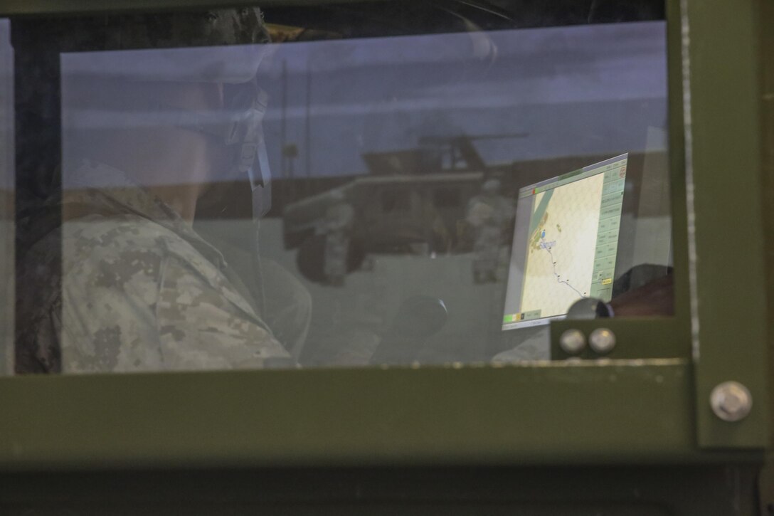 Cpl. Joshua Griffith, a motor transport operator with Transportation Support Co., Combat Logistics Battalion 2, operates a Blue Force Tracker during simulated High Mobility Multipurpose Wheeled Vehicle convoy training at Camp Lejeune, N.C., Oct. 7, 2015. Marines with the unit are undergoing Convoy Leader’s Course in preparation for an Integrated Training Exercise in Twentynine Palms, Calif., later this month. (U.S. Marine Corps photo by Cpl. Lucas Hopkins/Released)