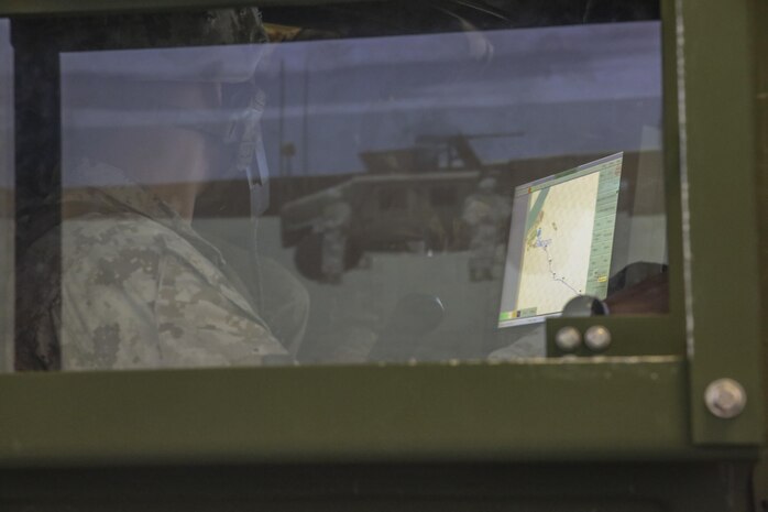 Cpl. Joshua Griffith, a motor transport operator with Transportation Support Co., Combat Logistics Battalion 2, operates a Blue Force Tracker during simulated High Mobility Multipurpose Wheeled Vehicle convoy training at Camp Lejeune, N.C., Oct. 7, 2015. Marines with the unit are undergoing Convoy Leader’s Course in preparation for an Integrated Training Exercise in Twentynine Palms, Calif., later this month. (U.S. Marine Corps photo by Cpl. Lucas Hopkins/Released)