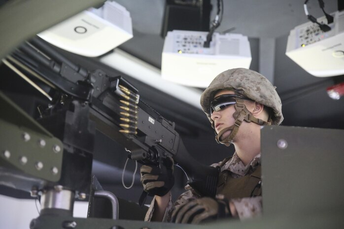 Lance Cpl. Luis Muniz, a motor transport operator with Transportation Support Co., Combat Logistics Battalion 2, mans an M240G medium machine gun during simulated High Mobility Multipurpose Wheeled Vehicle convoy training at Camp Lejeune, N.C., Oct. 7, 2015. Marines with the unit are undergoing Convoy Leader’s Course in preparation for an Integrated Training Exercise in Twentynine Palms, Calif., later this month. (U.S. Marine Corps photo by Cpl. Lucas Hopkins/Released)