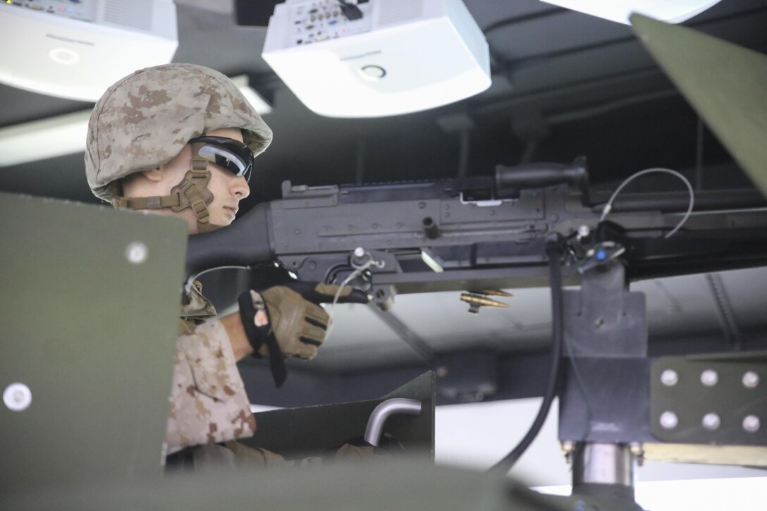 Lance Cpl. Luis Muniz, a motor transport operator with Transportation Support Co., Combat Logistics Battalion 2, mans a M240G Machine Gun during simulated High Mobility Multipurpose Wheeled Vehicle convoy training at Camp Lejeune, N.C., Oct. 7, 2015. Marines with the unit are undergoing Convoy Leader’s Course in preparation for an Integrated Training Exercise in Twentynine Palms, Calif., later this month. (U.S. Marine Corps photo by Cpl. Lucas Hopkins/Released)