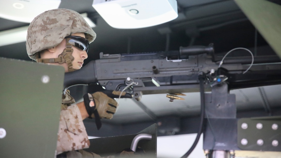 Lance Cpl. Luis Muniz, a motor transport operator with Transportation Support Co., Combat Logistics Battalion 2, mans a M240G Machine Gun during simulated High Mobility Multipurpose Wheeled Vehicle convoy training at Camp Lejeune, N.C., Oct. 7, 2015. Marines with the unit are undergoing Convoy Leader’s Course in preparation for an Integrated Training Exercise in Twentynine Palms, Calif., later this month. (U.S. Marine Corps photo by Cpl. Lucas Hopkins/Released)