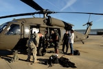 Tim Rodgers, a helicopter search and rescue lead for the North Carolina Helicopter Aquatic Rescue Team, prepares to give an interview for WSOC-TV based in Charlotte, North Carolina, at McEntire Joint National Guard Base, South Carolina, during a statewide flood response, Oct. 8, 2015. 