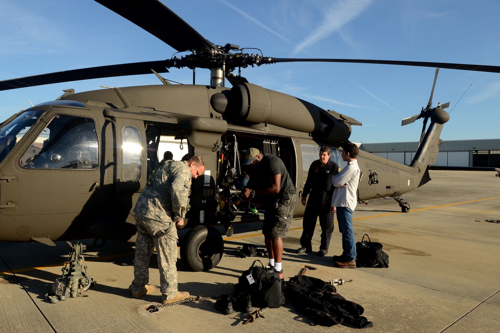 Tim Rodgers, a helicopter search and rescue lead for the North Carolina Helicopter Aquatic Rescue Team, prepares to give an interview for WSOC-TV based in Charlotte, North Carolina, at McEntire Joint National Guard Base, South Carolina, during a statewide flood response, Oct. 8, 2015. 