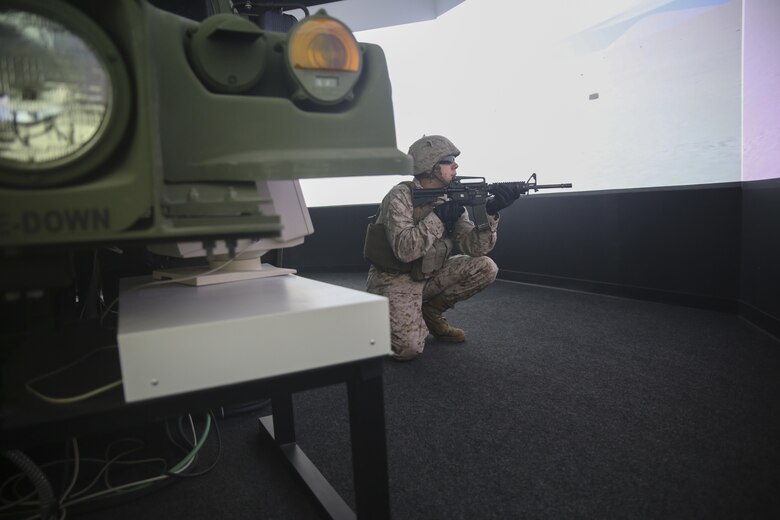 Lance Cpl. Ryan Leech, a motor transport operator with Transportation Support Co., Combat Logistics Battalion 2, posts security during simulated High Mobility Multipurpose Wheeled Vehicle convoy training at Camp Lejeune, N.C., Oct. 7, 2015. Marines with the unit are undergoing Convoy Leader’s Course in preparation for an Integrated Training Exercise in Twentynine Palms, Calif., later this month. (U.S. Marine Corps photo by Cpl. Lucas Hopkins/Released)