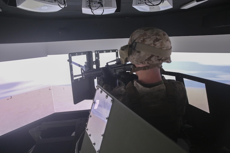 Cpl. Mason Archer, a motor transport operator with Transportation Support Co., Combat Logistics Battalion 2, fires simulated rounds at a fictional enemy during simulated High Mobility Multipurpose Wheeled Vehicle convoy training at Camp Lejeune, N.C., Oct. 7, 2015. Approximately 25 Marines with the unit are undergoing Convoy Leader’s Course in preparation for an Integrated Training Exercise in Twentynine Palms, Calif., later this month. (U.S. Marine Corps photo by Cpl. Lucas Hopkins/Released)