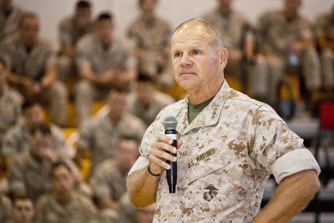 Commandant of the Marine Corps, Gen. Robert B. Neller, speaks to Marines, Sailors and civilians at Goettge Memorial Field House, Camp Lejeune, N.C., Oct. 8, 2015. Neller outlined the Corps current priorities, expectations, listened and answered questions during his Lejeune visit. (U.S. Marine Corps photo by Sgt. Gabriela Garcia/Released)