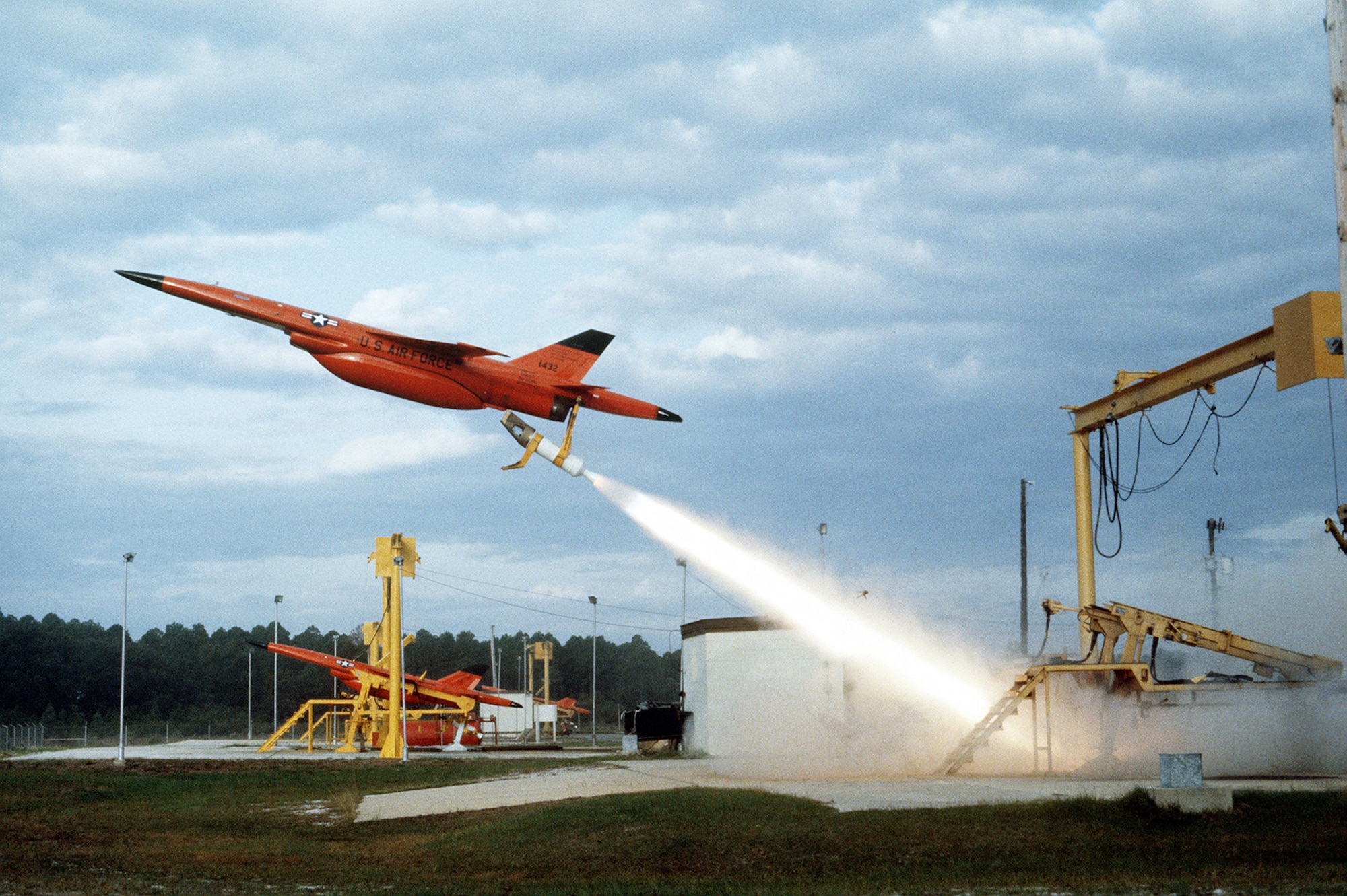 Ryan BQM-34F Firebee II target leaves its launch pad during an air-to-air combat training exercise in 1982, while another stands ready for launch in the background. (U.S. Air Force photo)