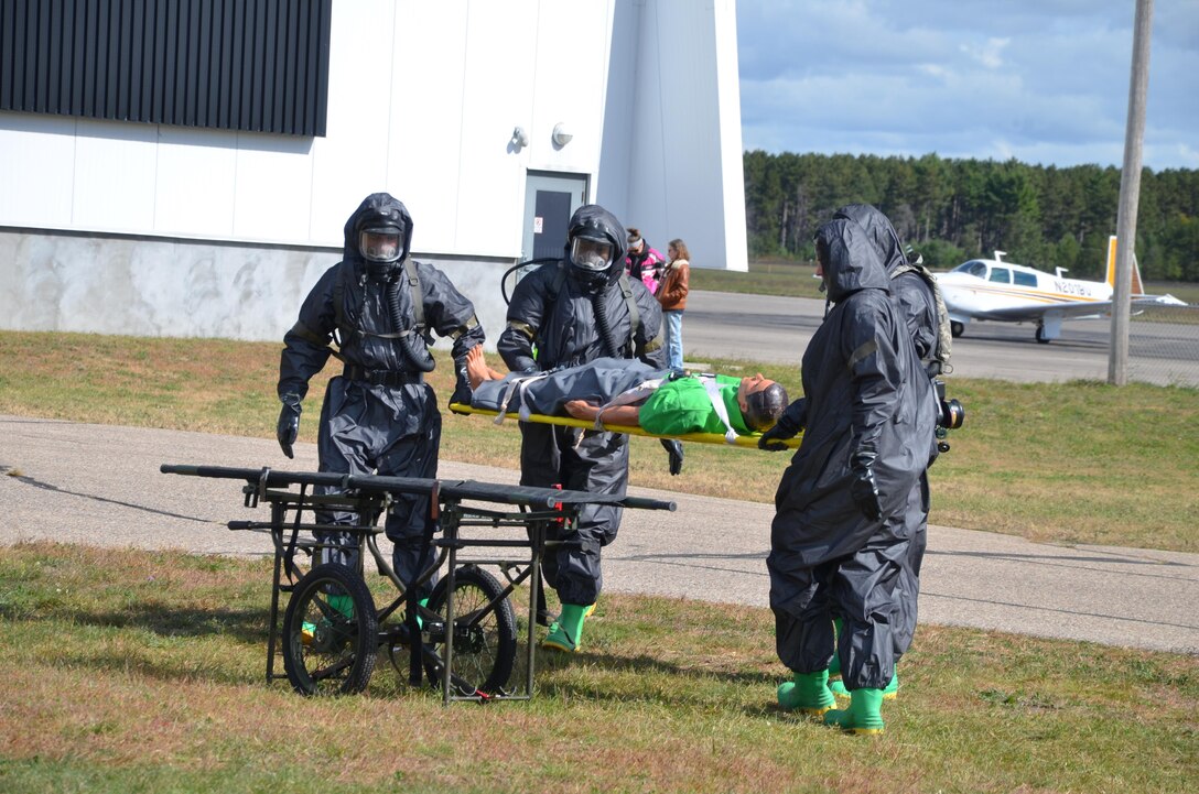 U.S. Army Reserve Soldiers with the 388th Chemical Biological Radiological Nuclear Company, out of Junction City, Wis., participated in a joint training exercise at the Stevens Point Municipal Airport Oct. 3, 2015. The 409th Area Support Medical Company out of Madison, Wis. and local Stevens Point and Portage County officials participated and observed. Local civilians volunteered to role play as casualties, including a family with two small children, bringing a new level of realism to this exercise and giving Soldiers real world experience in the delicate handling of children in mass casualty decontamination scenarios. The joint exercise gave everyone involved a chance to experience what their role would be in a real world emergency. Army Reserve Soldiers play a supporting role to the local officials, so it is vital to learn how to communicate and coordinate across organizations.