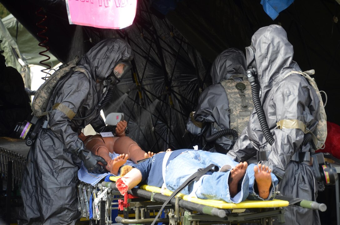 U.S. Army Reserve Soldiers with the 388th Chemical Biological Radiological Nuclear Company, out of Junction City, Wis., participated in a joint training exercise at the Stevens Point Municipal Airport Oct. 3, 2015. The 409th Area Support Medical Company out of Madison, Wis. and local Stevens Point and Portage County officials participated and observed. Local civilians volunteered to role play as casualties, including a family with two small children, bringing a new level of realism to this exercise and giving Soldiers real world experience in the delicate handling of children in mass casualty decontamination scenarios. The joint exercise gave everyone involved a chance to experience what their role would be in a real world emergency. Army Reserve Soldiers play a supporting role to the local officials, so it is vital to learn how to communicate and coordinate across organizations.