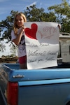 Camren Roebuck, a 9-year-old Angels Camp resident, holds a poster thanking California Army National Guardsmen assigned to the Butte Fire in Calaveras County, California, Sept. 24. Camren, a fourth-grader at Mark Twain Elementary School, was watching California Guard tactical vehicles return to base camp. 