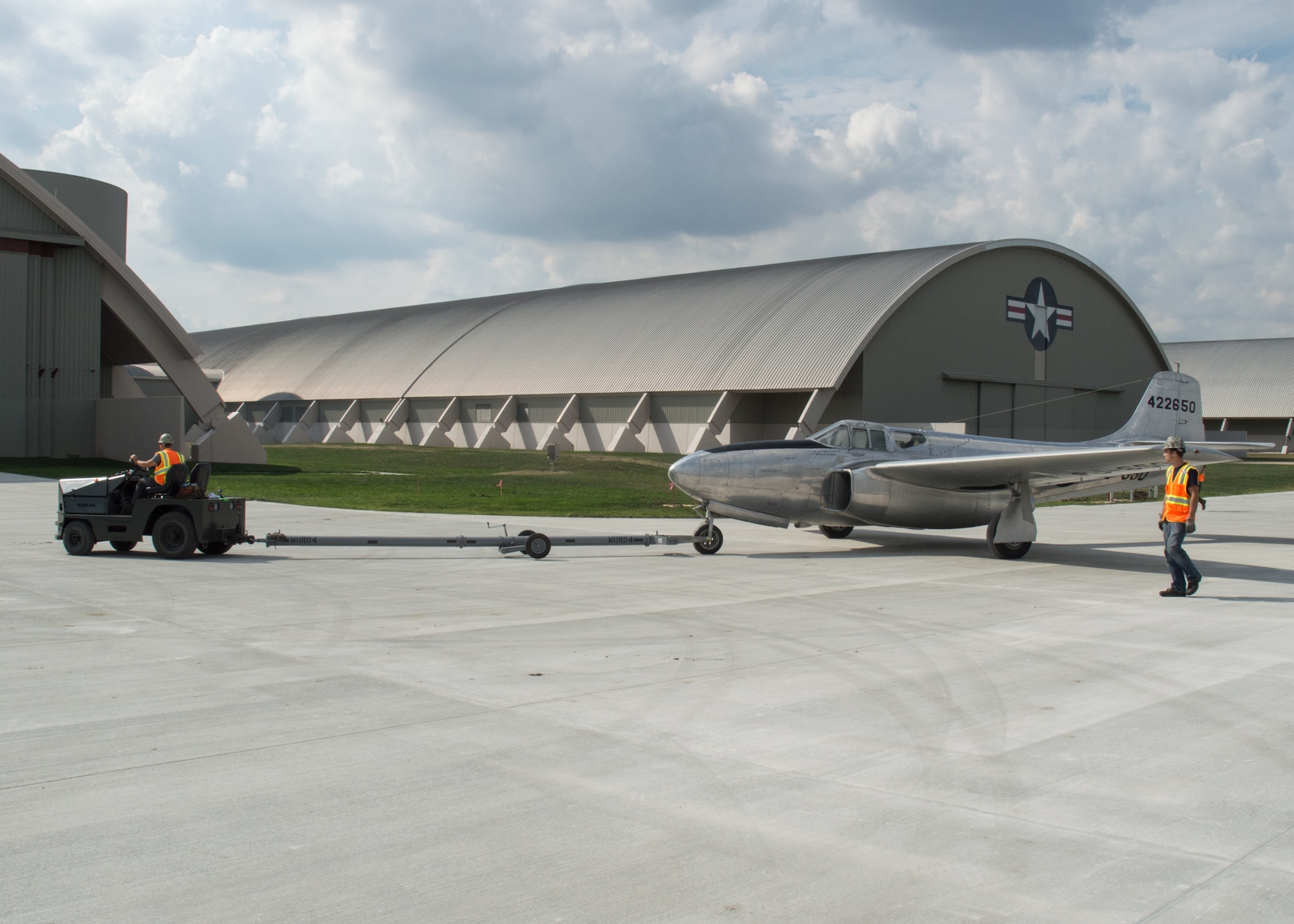 Restoration staff move the Bell P-59B into the new fourth building at the National Museum of the U.S. Air Force on Oct. 8, 2015. (U.S. Air Force photo by Ken LaRock)