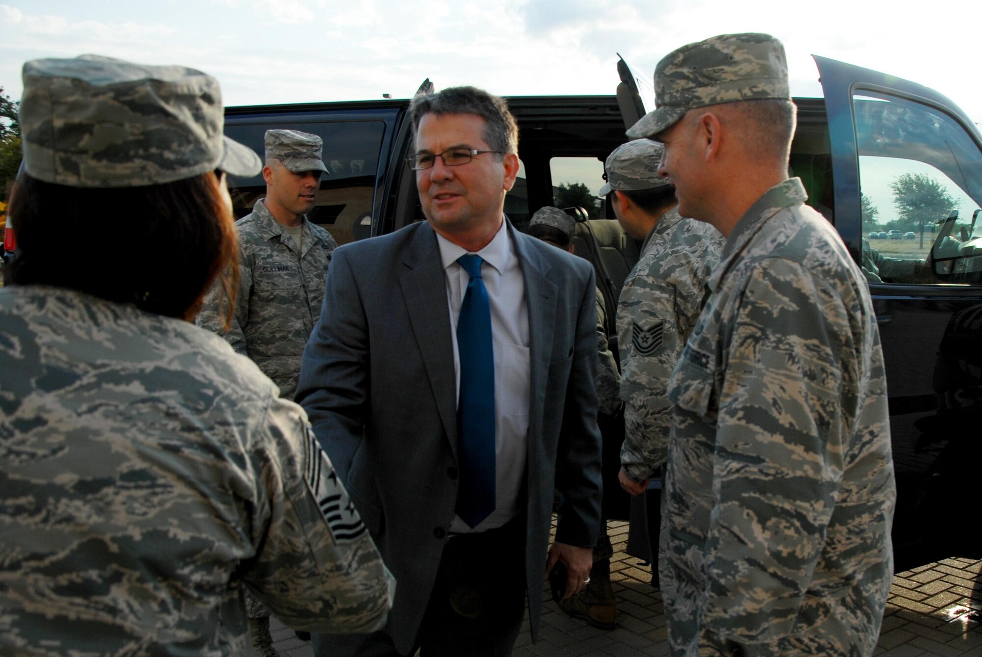 Sen. Charles L. Perry, 28th District of Texas Agriculture, Water and Rural Affairs Chairman, meets U.S. Air Force Col. Michael L. Downs, 17th Training Wing Commander, and Chief Master Sgt. JoAnne S. Bass, 17th TRW Command Chief, at the Norma Brown Building on Goodfellow Air Force Base, Texas, Oct. 8, 2015. Perry visited the base to learn about its mission. (U.S. Air Force photo by Senior Airman Joshua Edwards/Released)