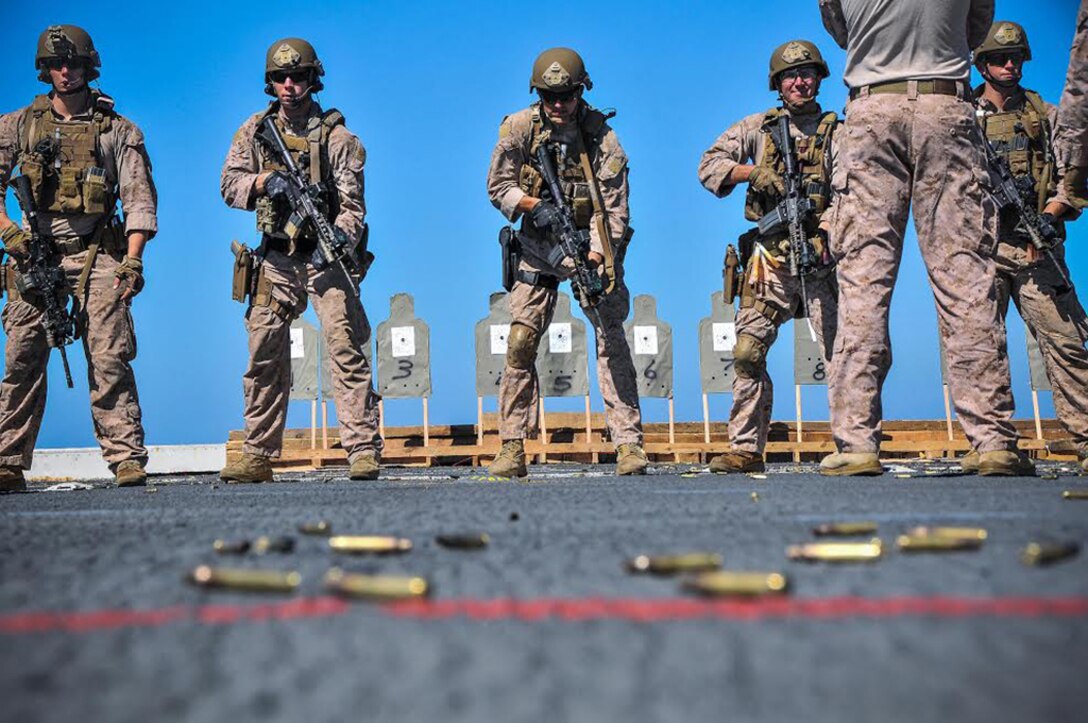 Marines with the 13th Marine Expeditionary Unit participate in a live-fire exercise on the flight deck of the USS New Orleans in the Pacific Ocean, Sept. 30, 2015. U.S. Navy photo by Petty Officer 1st Class Gary Granger Jr.

