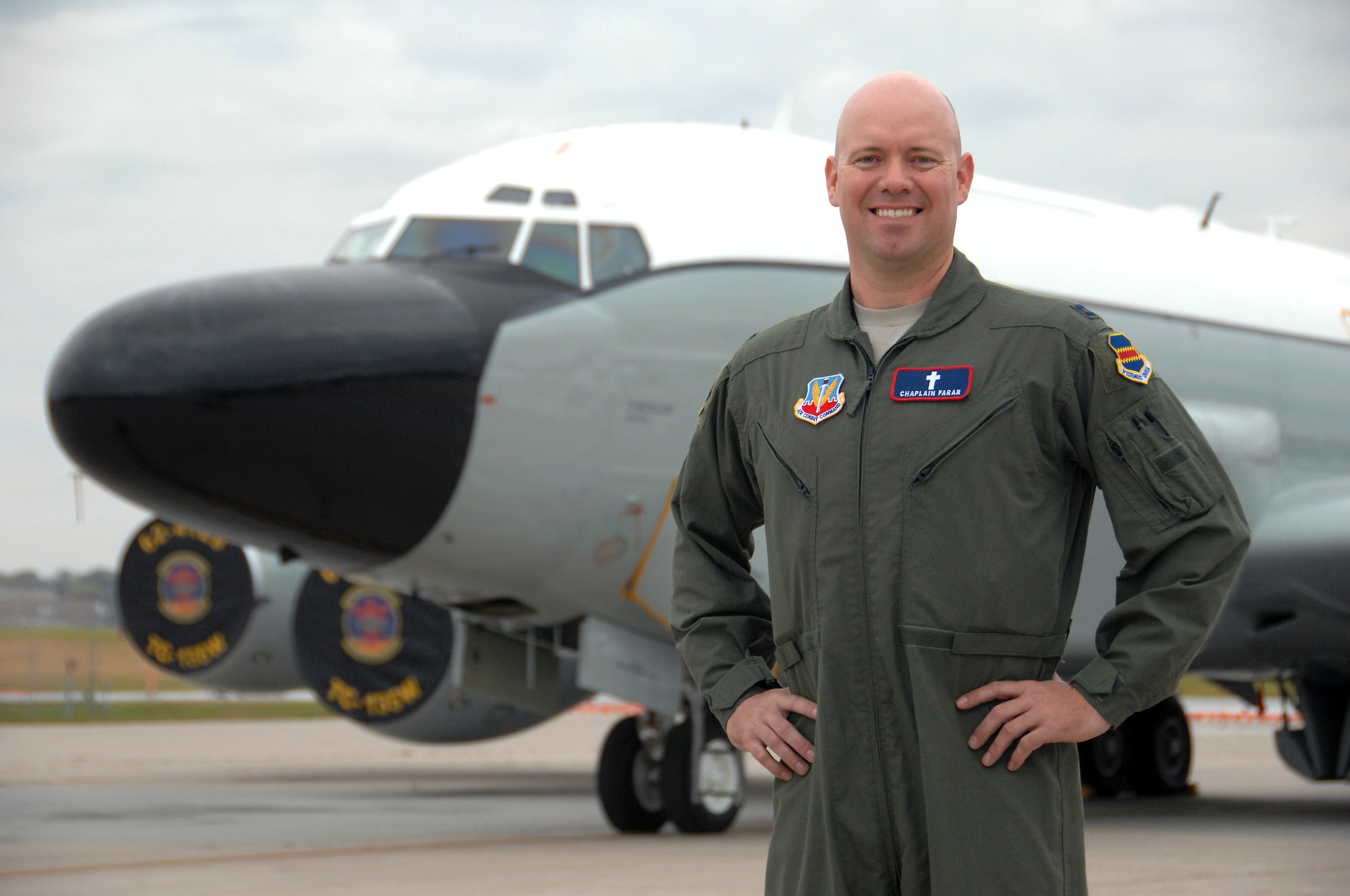 Chaplain (Capt.) Michael Farar poses in front of an RC-135 Rivet Joint aircraft at Offutt Air Force Base, Neb., Oct. 7, 2015. Farar is believed to be the first aerial-qualified chaplain to fly on operational missions with the 55th Wing and is also believed to be the first chaplain on aeronautical orders within Air Combat Command. (U.S. Air Force photo/Delanie Stafford)