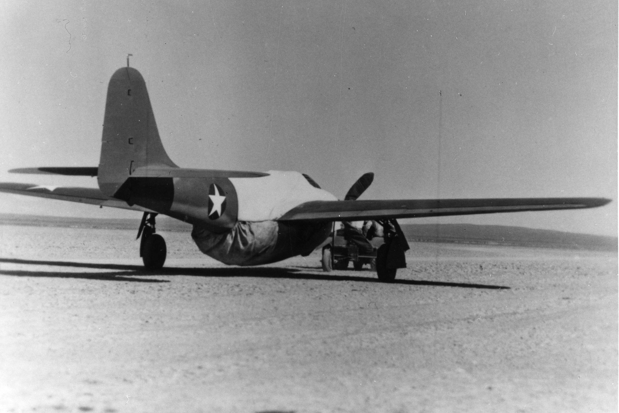 To maintain secrecy, prototype Airacomets were towed to and from the flightline with a fake propeller and a cover over the engine exhausts and intakes. (U.S. Air Force photo)