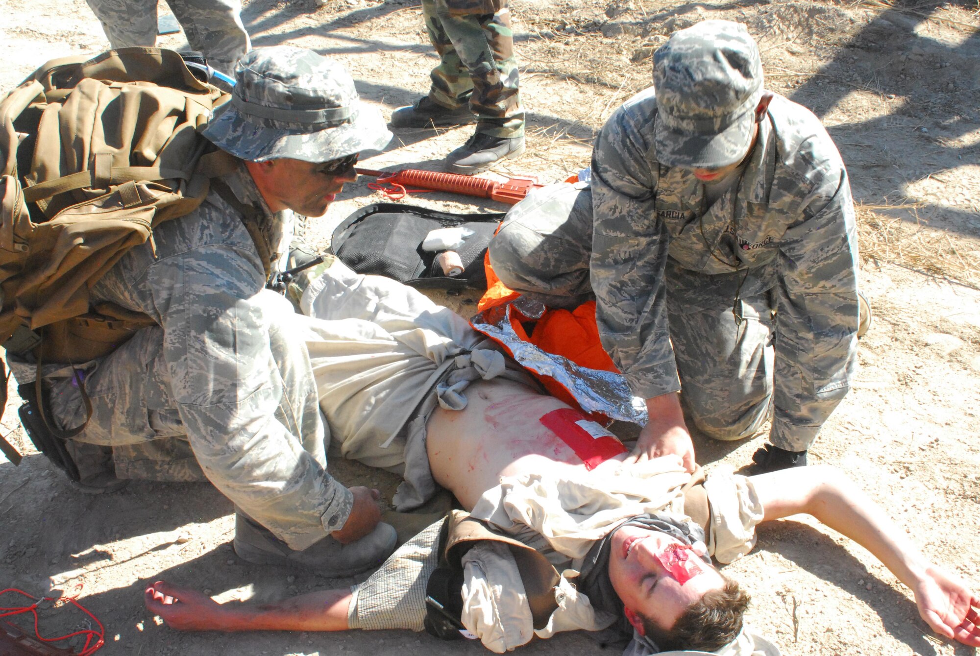 Airmen from the 460th Medical Group care for a patient during a training exercise Oct. 3, 2015, at Fort Carson, Colo. The 460th MDG completed annual combat leadership and combat medic training in order to prepare themselves for situations they could find themselves in while deployed in a hostile environment. (Courtesy photo)