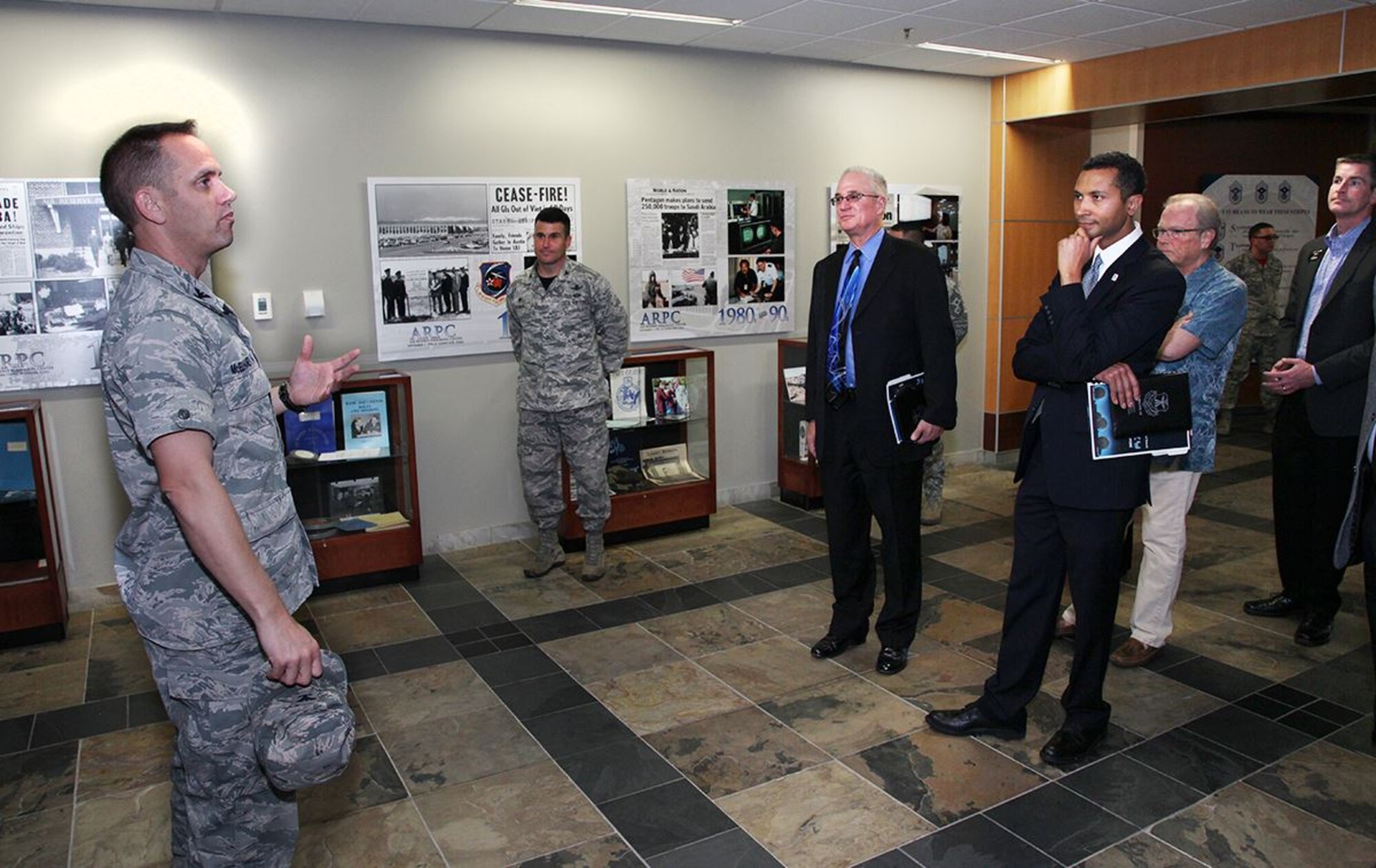 Col. Sean McElhaney Pahia, Air Reserve Personnel Center vice commander, greets and gives a mission brief to visitors during Mayor’s Day at Headquarters ARPC Oct. 8, 2015, on Buckley Air Force Base, Colo. The local mayors and visitors who attended the event included Mayor Steve Hogan, Mayor Cathy Noon, Mayor Herb Atchison, Mayor Phillip Cernanec, Mayor Clint Folsom, Mayor Heidi Williams, Mayor Joyce Thomas, Mayor Marjorie Sloan, Mr. Peter Kenney, Mr. Anthony Graves, Col. John Wagner, 460th Space Wing commander, Col. Scott Romberger, 460 SW vice commander, and Chief Master Sgt. Brian Kruzelnick, 460 SW command chief. (U.S. Air Force photo/Quinn Jacobson) 